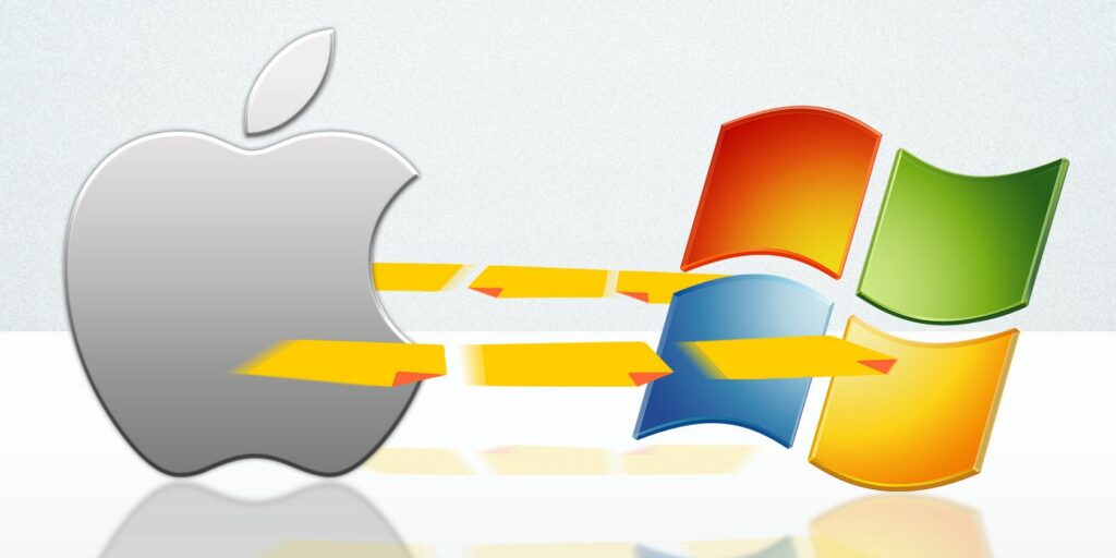 Apple Mac and Windows PC logos transfering files.