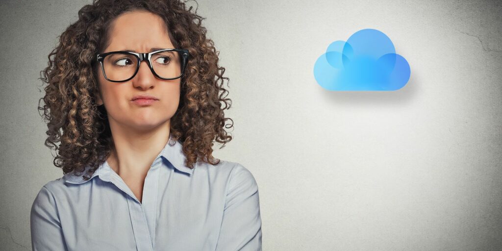 Unhappy woman next to an iCloud logo.