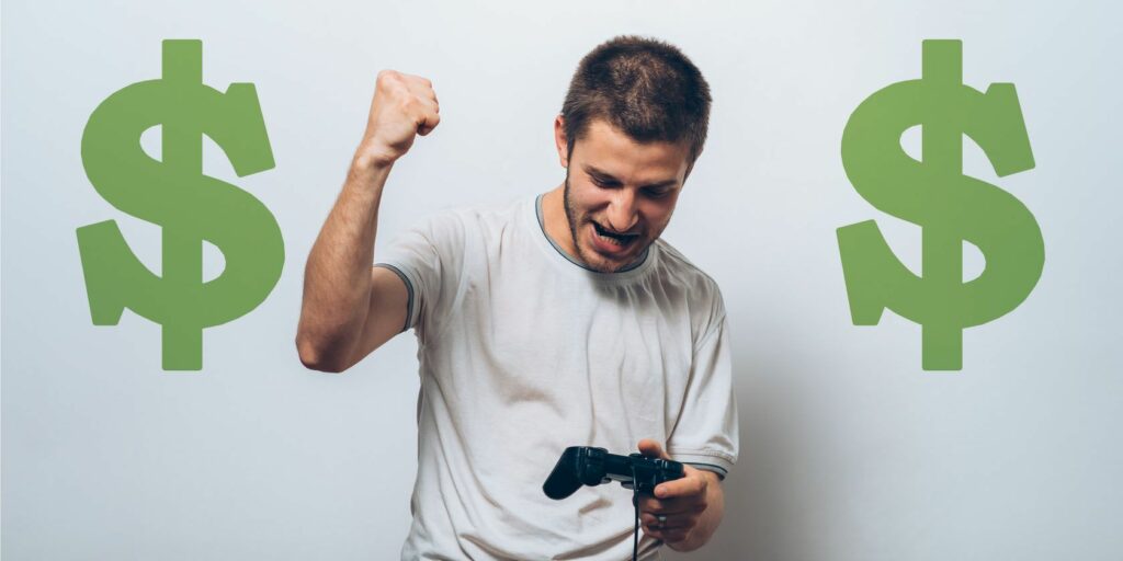 Man holding video game controller excitedly, with dollar signs around him