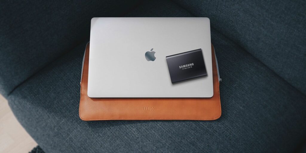 MacBook with Samsung external storage drive on top of it.