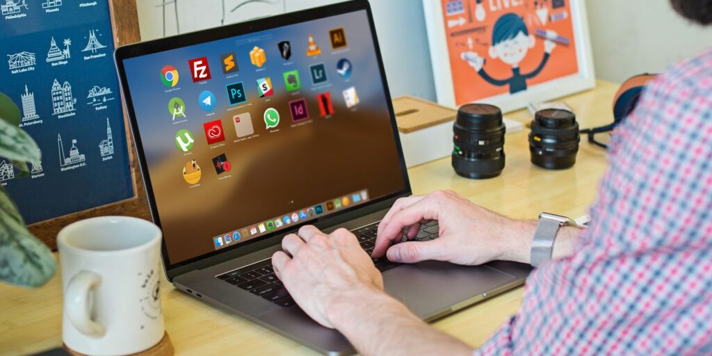 Person opening multiple apps from the Launchpad on a Mac