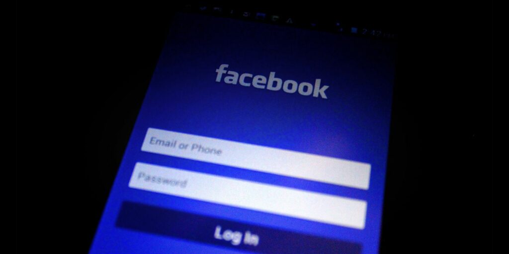 Facebook login page on a smartphone in the dark