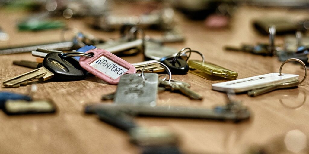 Various keys sitting on table