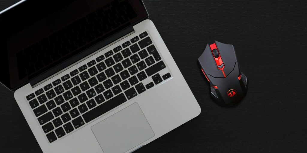 Third-party mouse next to a MacBook