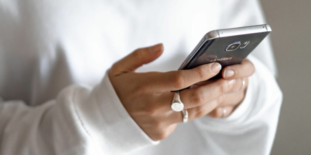 woman texting on android phone