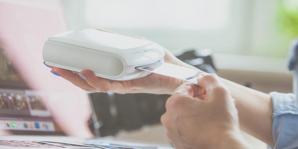 Photo printer in a person's hands