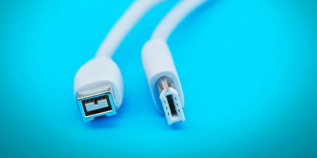 firewire cable on blue background feature image